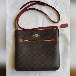 Coach Medium Rowan file bag brown in signature canvas with smooth leather trim